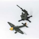 A Dinky die cast 88mm gun together with a Dinky Junkers Ju 87B