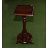 An Edwardian mahogany plant stand