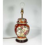 An Oriental style pottery table lamp with floral design 30cm tall