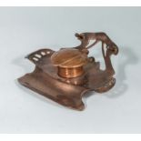 An Art Nouveau copper ink well