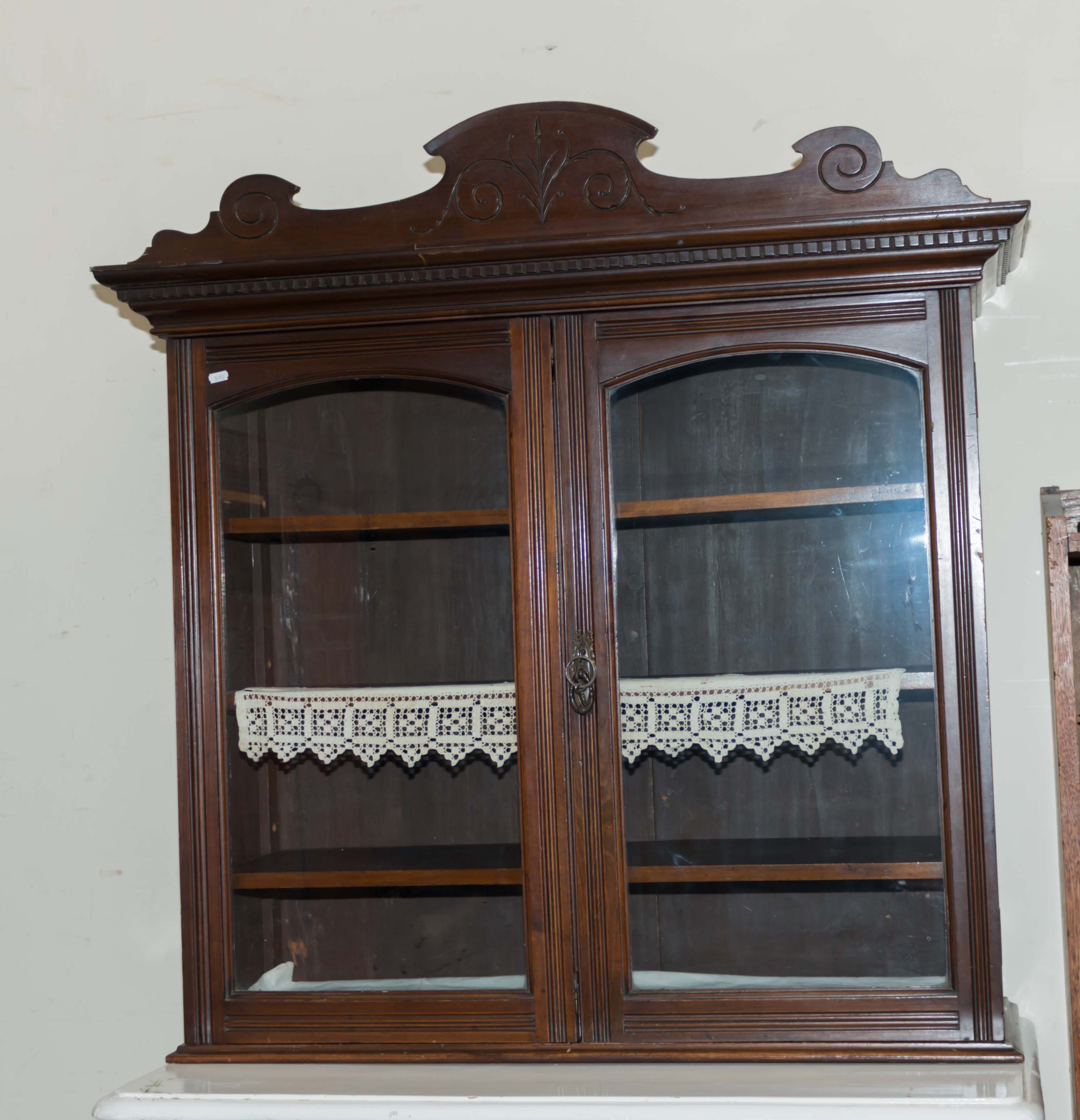 A late Victorian bookcase top