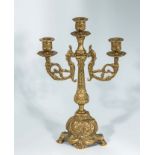 A brass three branch candelabra
