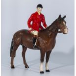 A Beswick horse and huntsman