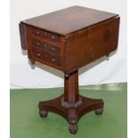 A Victorian drop leaf pedestal table.