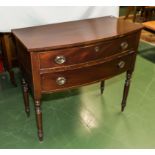 A small mahogany side table .