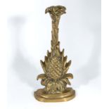 A brass pineapple doorstop 34cm tall