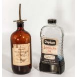 A vintage bottle of Stephens Ink and an ink distributor