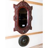 A carved framed mirror and gong