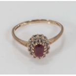 A 9ct gold ruby and diamond ring, size M