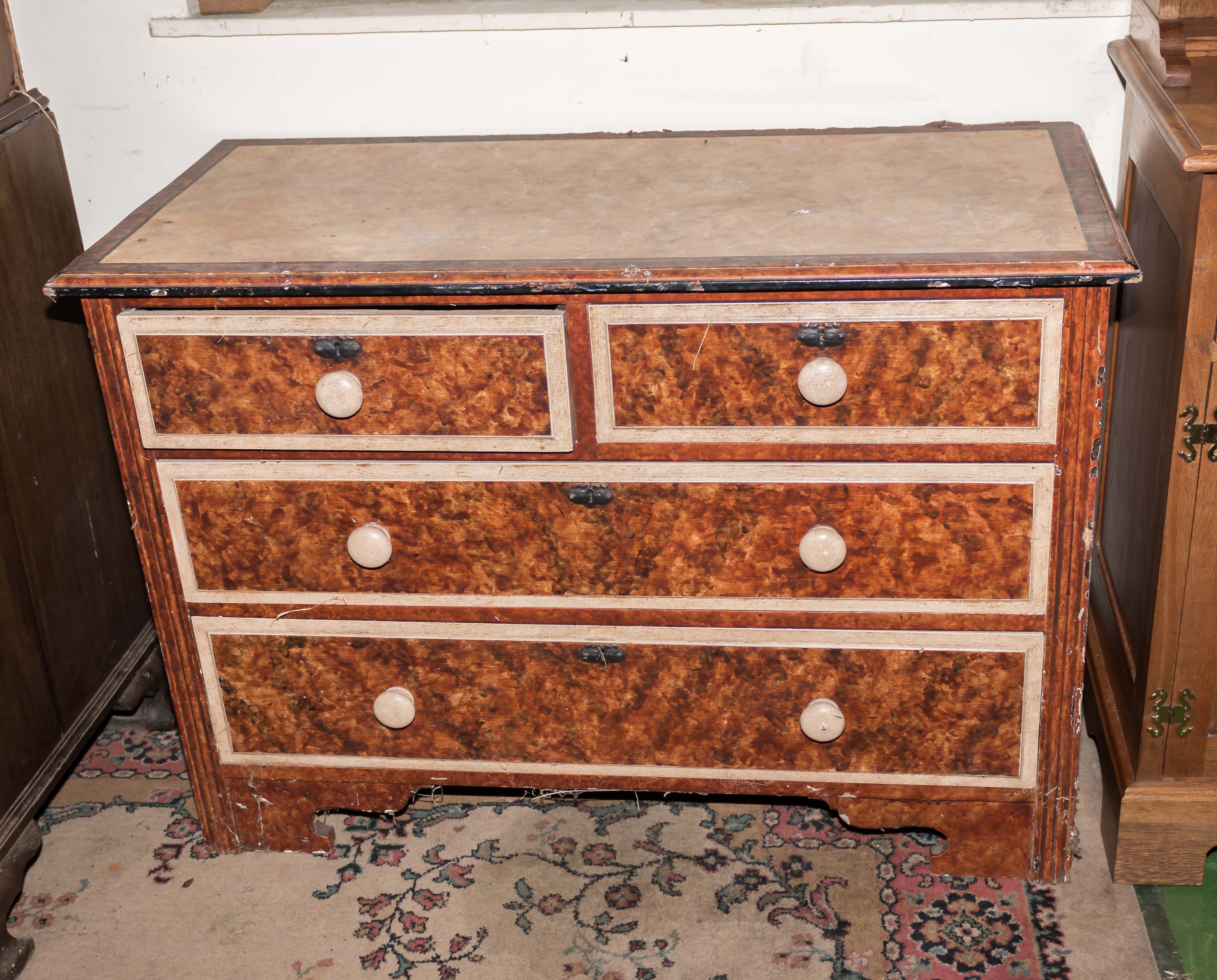 An antique scumble pine chest of two drawers over two