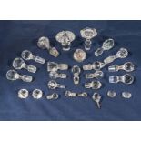 A collection of glass decanter stoppers and other items