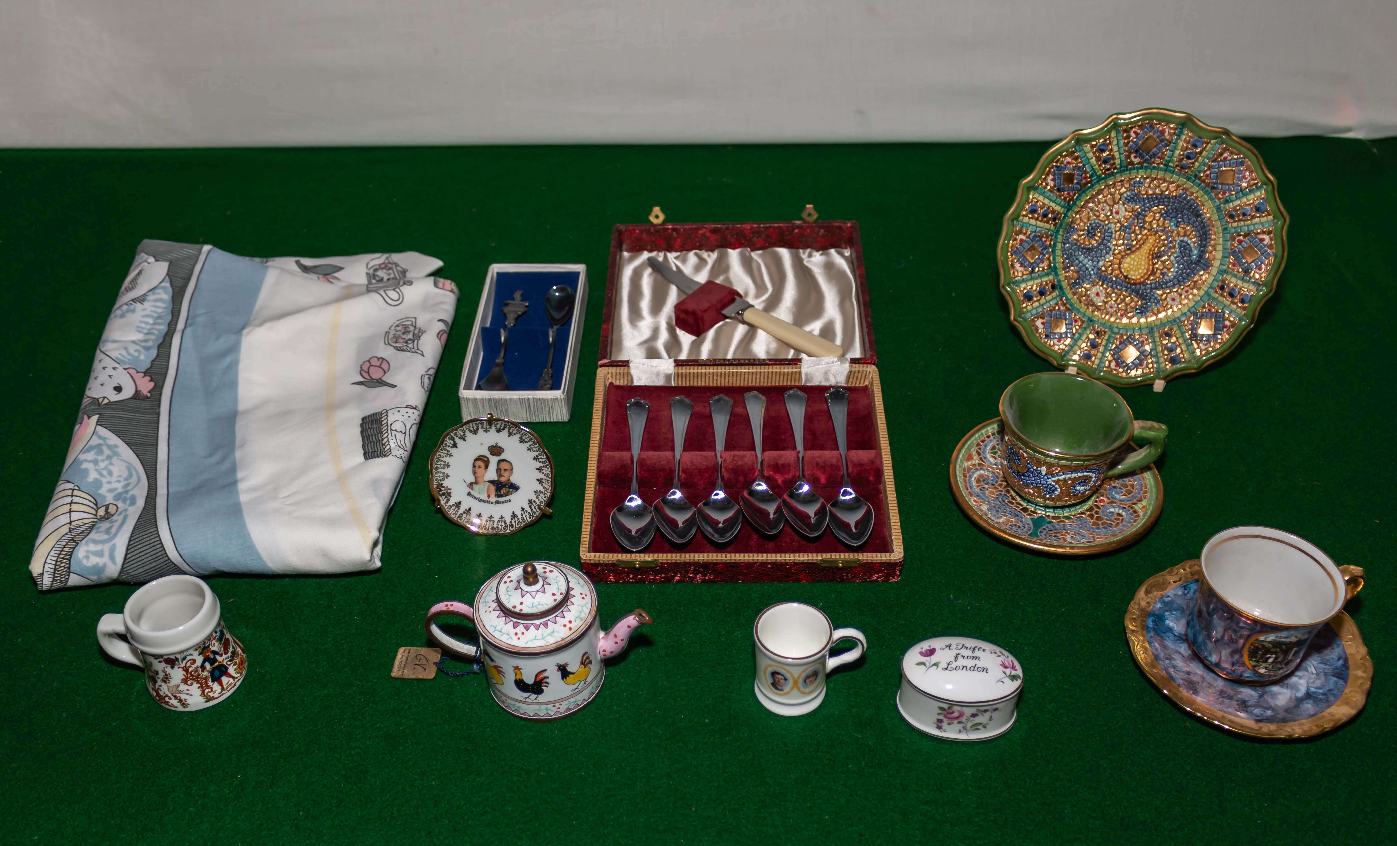 A box containing cutlery, pottery and other items