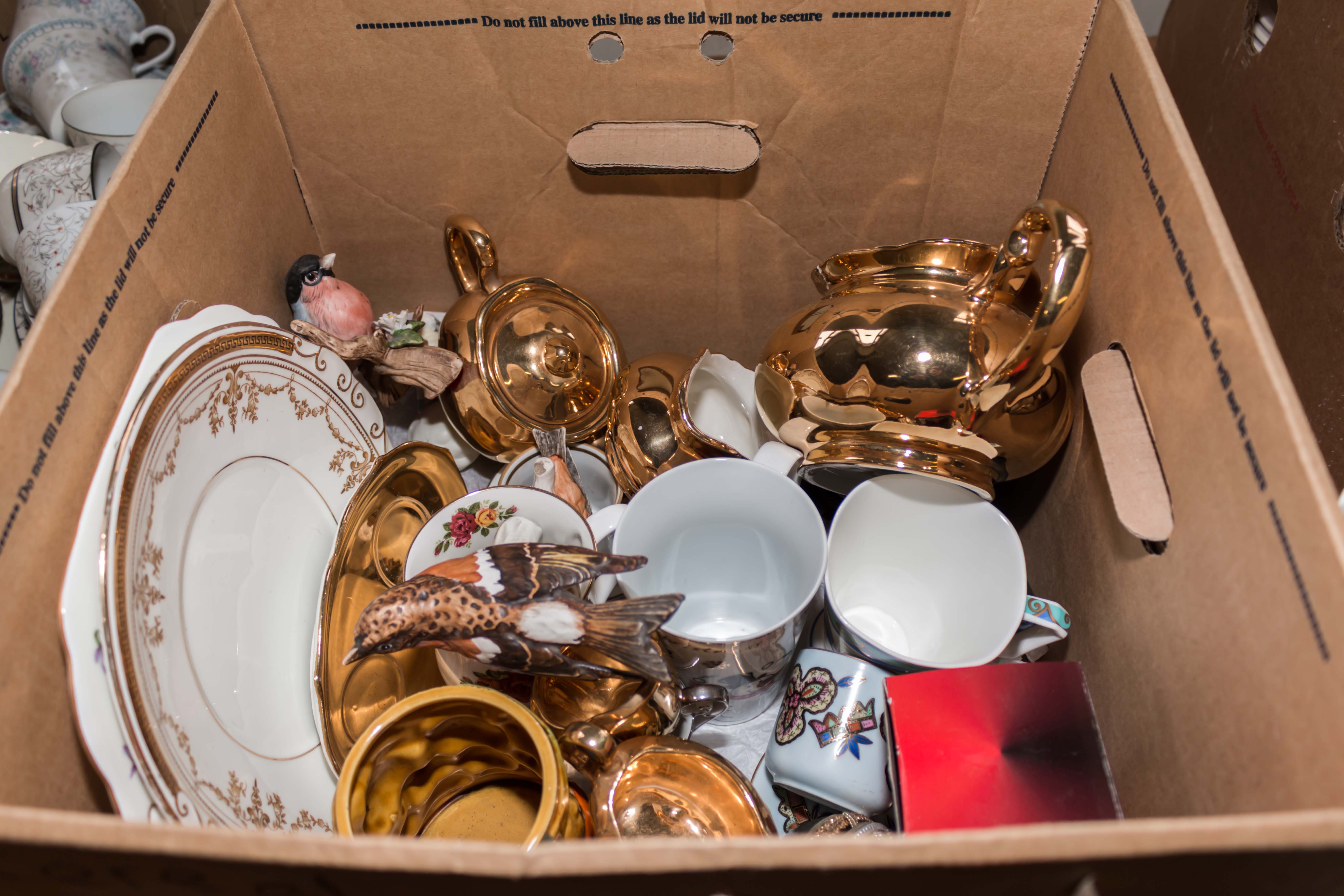 A box containing china and pottery