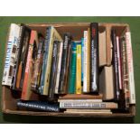 A box containing books relating to furniture restoration