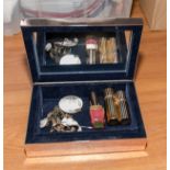 A vintage jewellery box and contents
