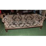An Edwardian upholstered sofa