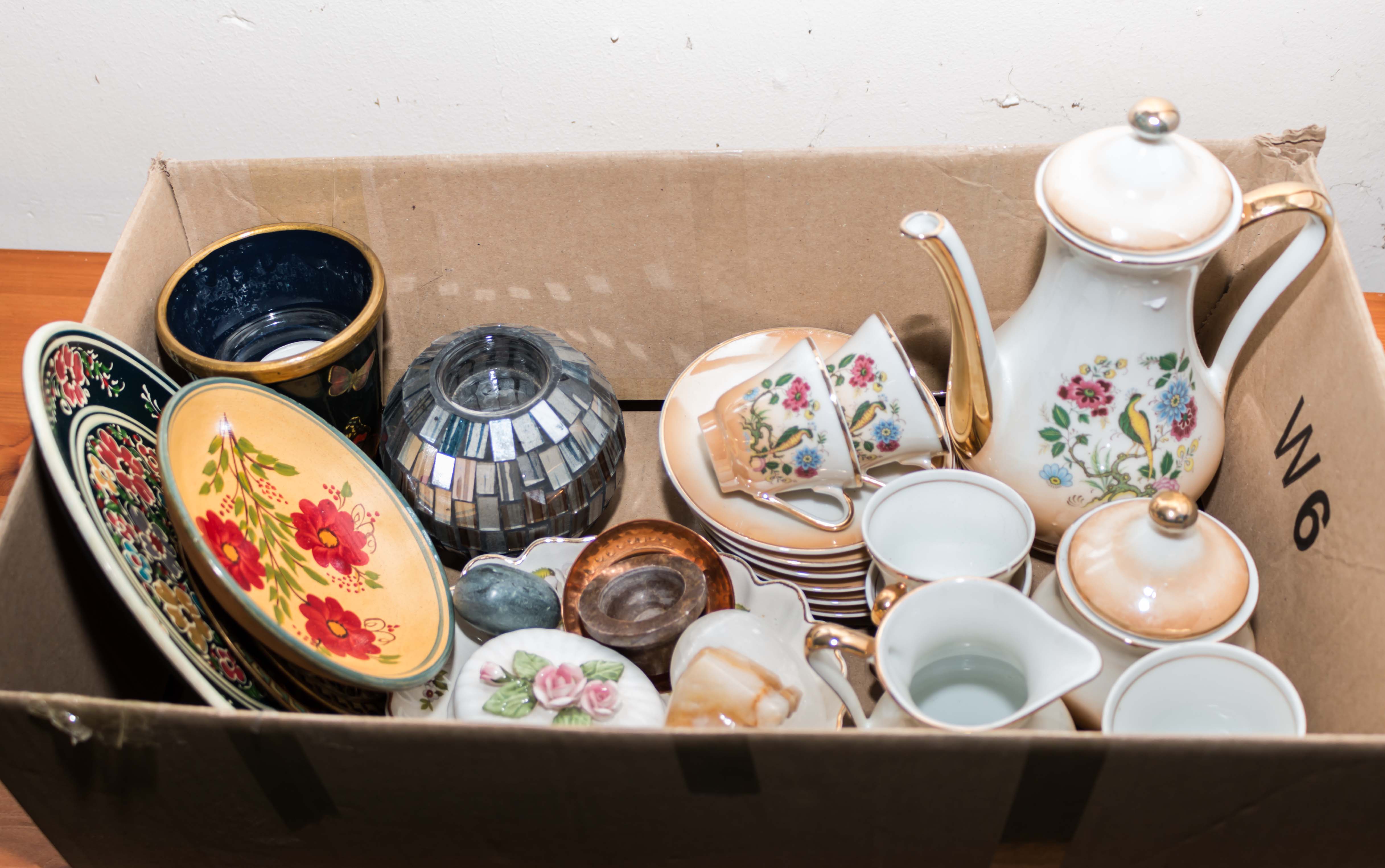 A box containing pottery and china