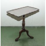 A mahogany pie crust top side table