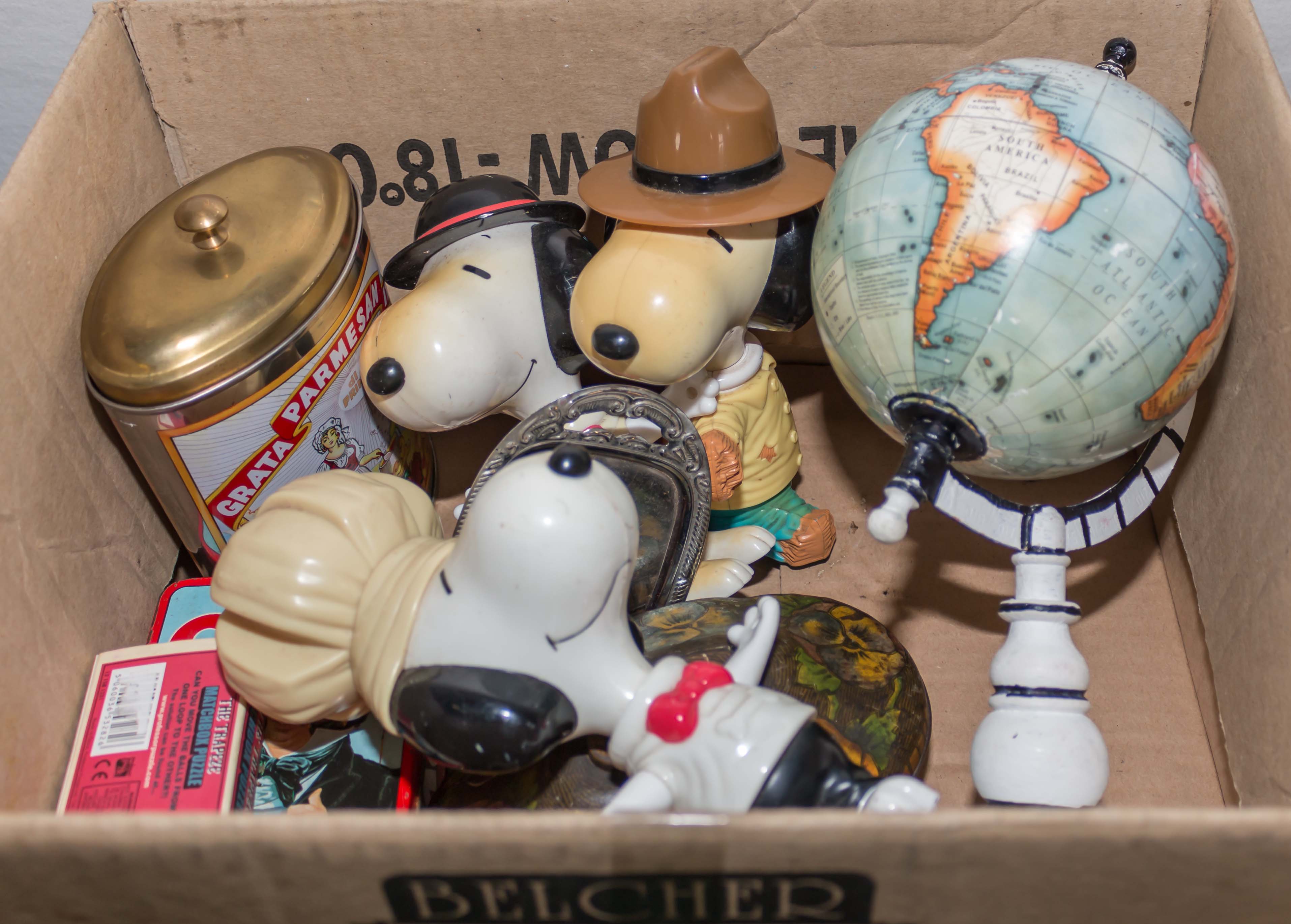 A box containing toys and a globe