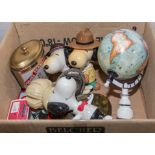 A box containing toys and a globe