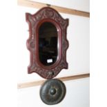 A wall mirror and gong