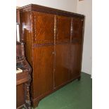 A 1940's three door wardrobe