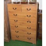 A tall chest of drawers