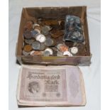 A box of foreign coins and German paper marks