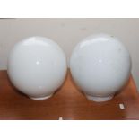 Two white glass light shades
