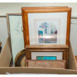 A box containing framed prints