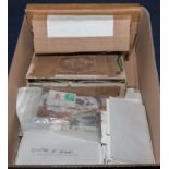 A box containing first day covers and stamps