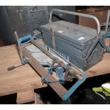 A mitre saw and a tool box