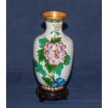 A cloisonne vase on stand