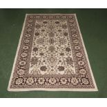 A cream ground woollen rug