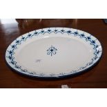 A blue and white enamel meat plate