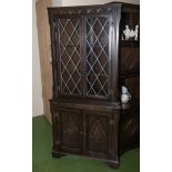 A corner cabinet with glazed doors