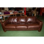 A three seater brown leather sofa