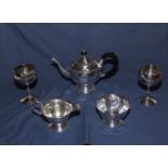 A three piece silver plated tea service and two goblets