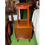 A retro bedside cupboard and a small table