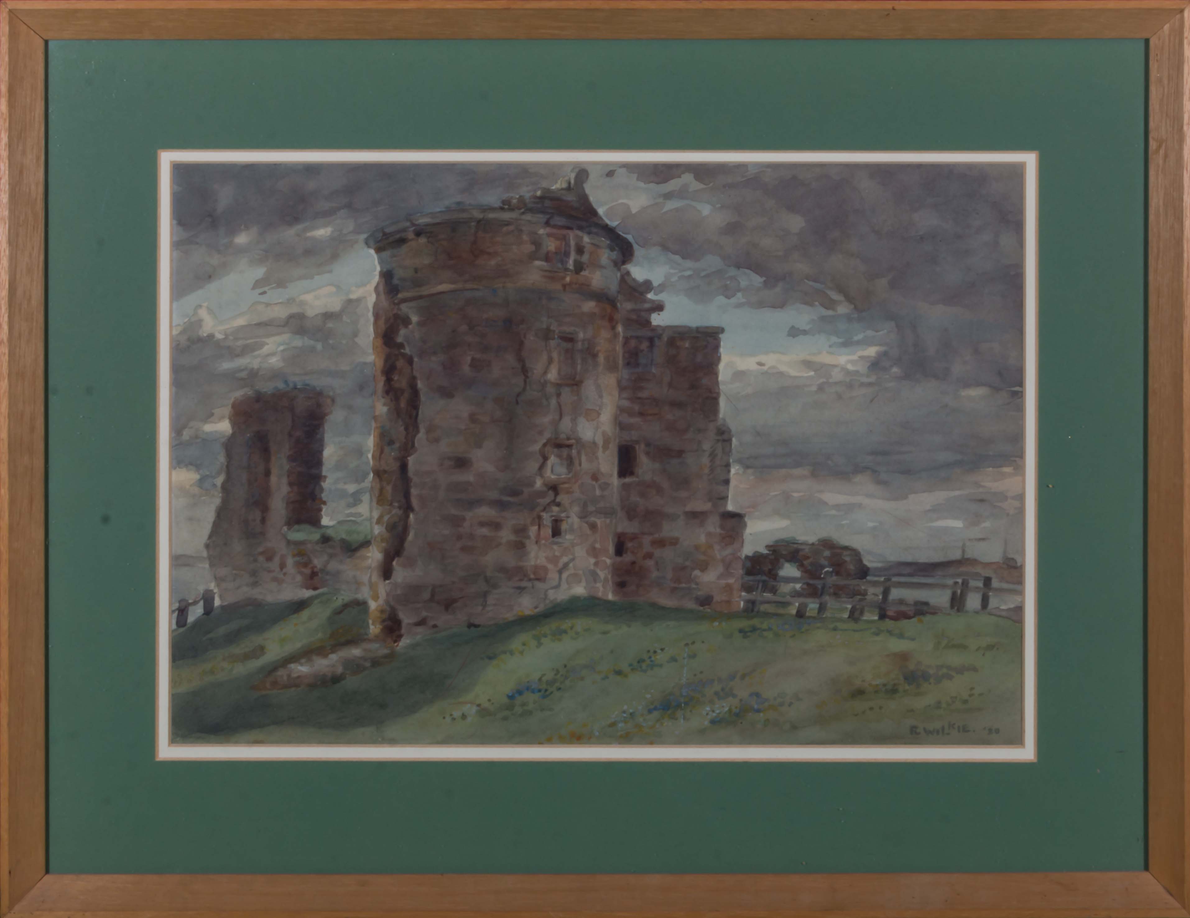 A framed watercolour depicting a ruined castle signed R Wilkie