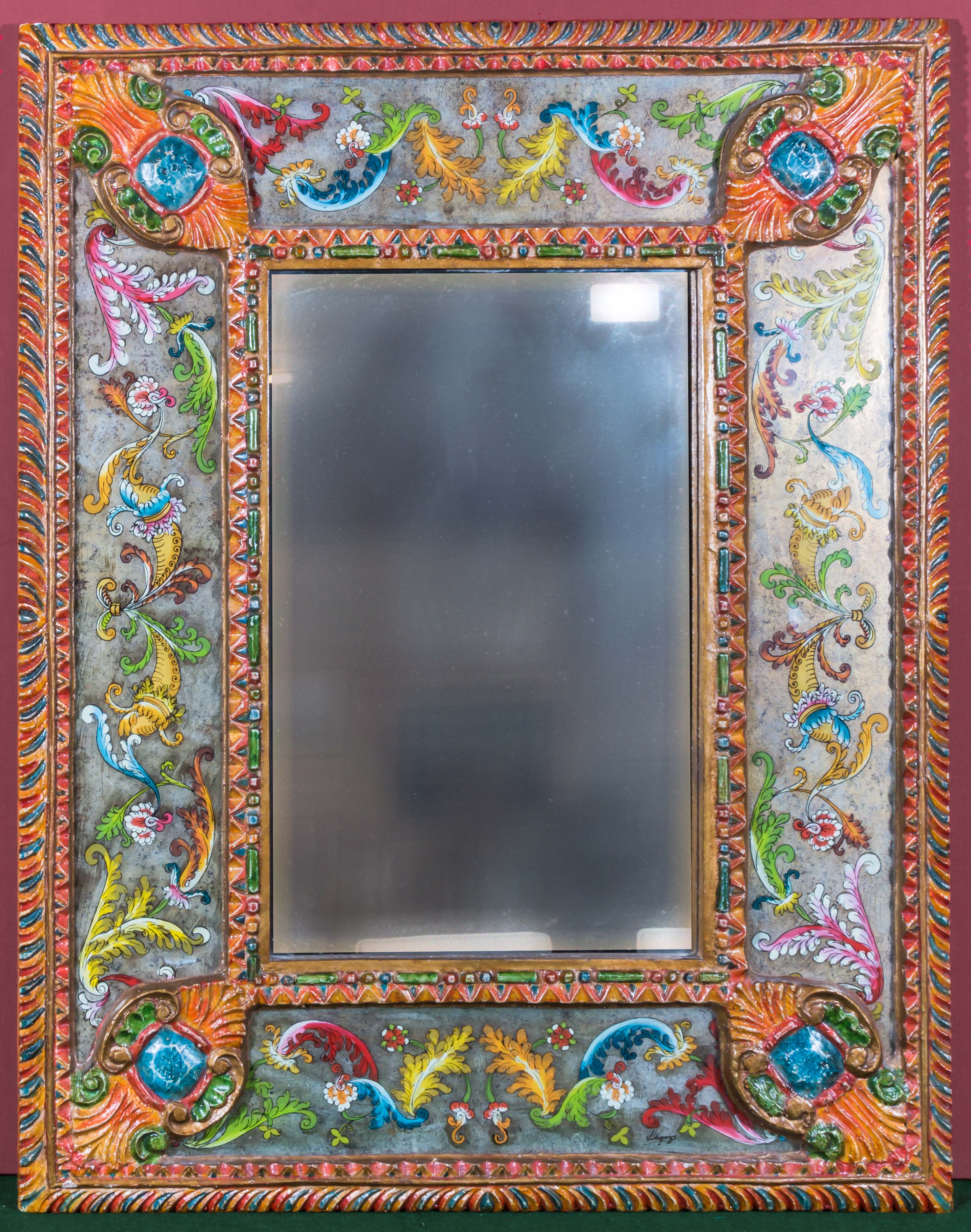A mirror with decorative hand painted Mexican surround