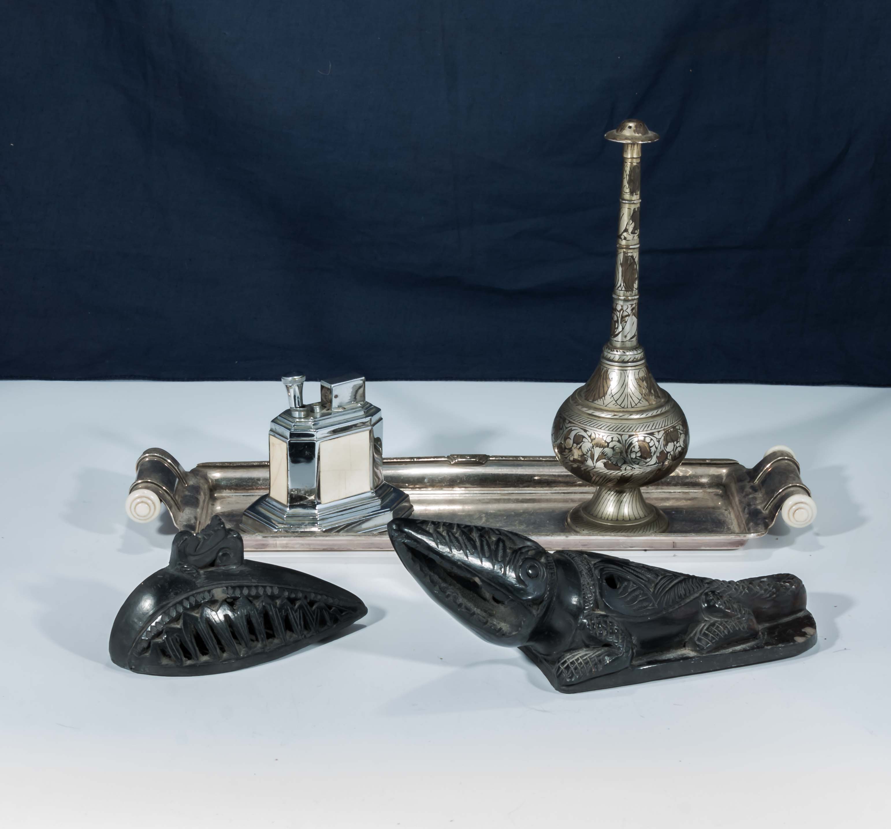 Two coal carvings, a Ronson table lighter and two others