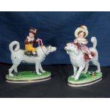 A rare pair of Bloor Derby figures of children riding dogs 1806-1825