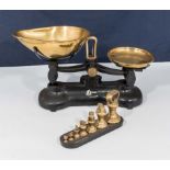 A set of vintage cast and brass weigh scales with weights