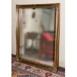 A large gilt framed wall mirror