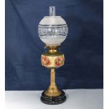 A brass and porcelain oil lamp