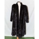 A lady's 1970's full length black mink coat, pelts in excellent condition