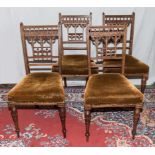 A set of four walnut Aesthetic movement chairs, matching lot 352