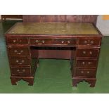 A leather topped pedestal desk