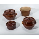 Two brown glazed casserole dishes together with a pudding bowl by Pearsons of Chesterfield and a